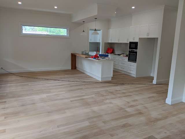 Brown-stained Australian Chestnut completed flooring project
